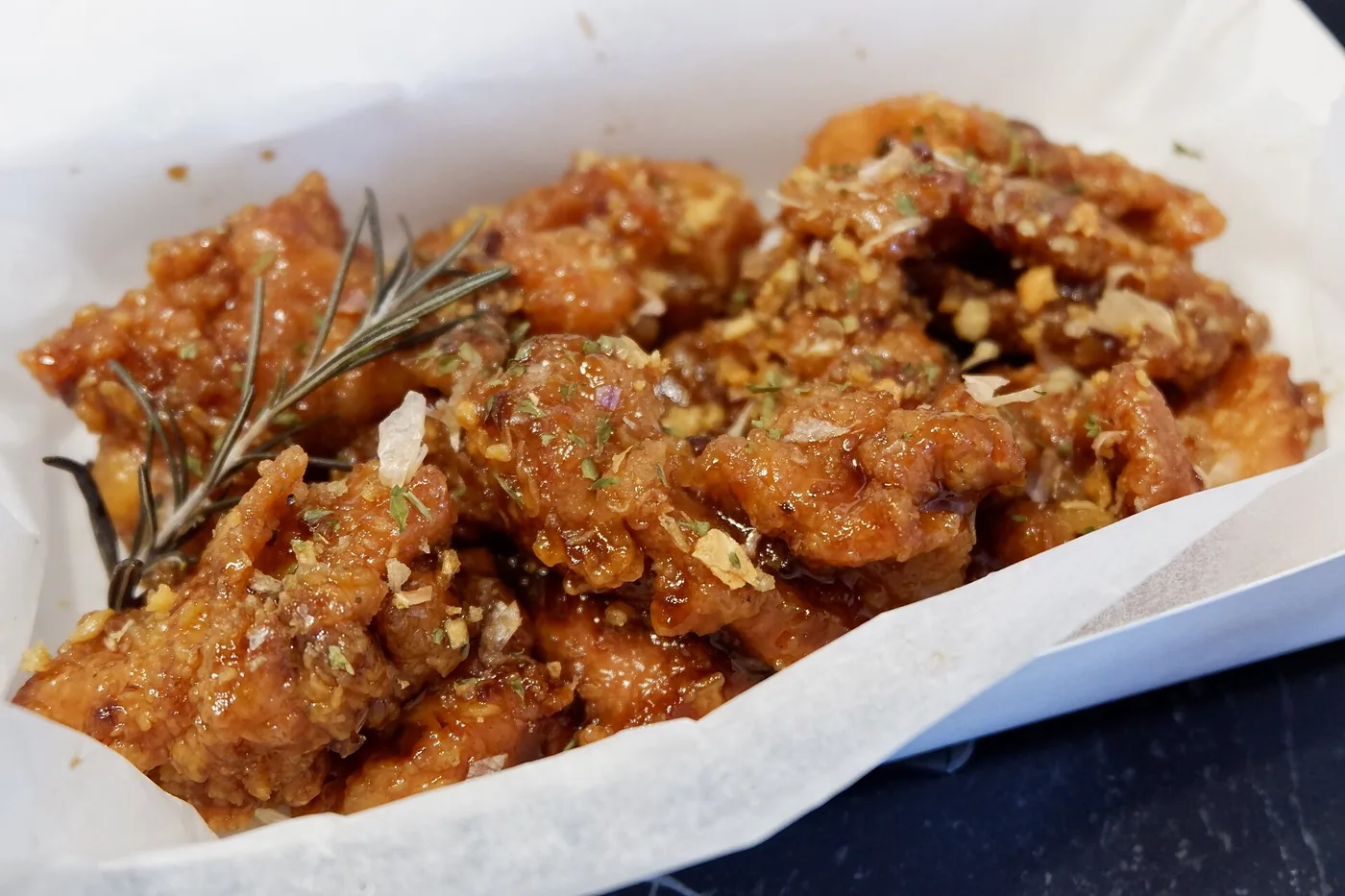 Cheese-seasoned Korean fried chicken representing bhc’s bold flavor style