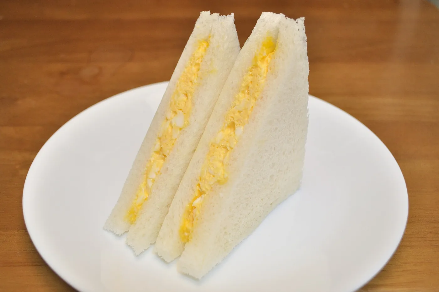 Korean grilled breakfast toast filled with egg, cabbage, cheese and ham