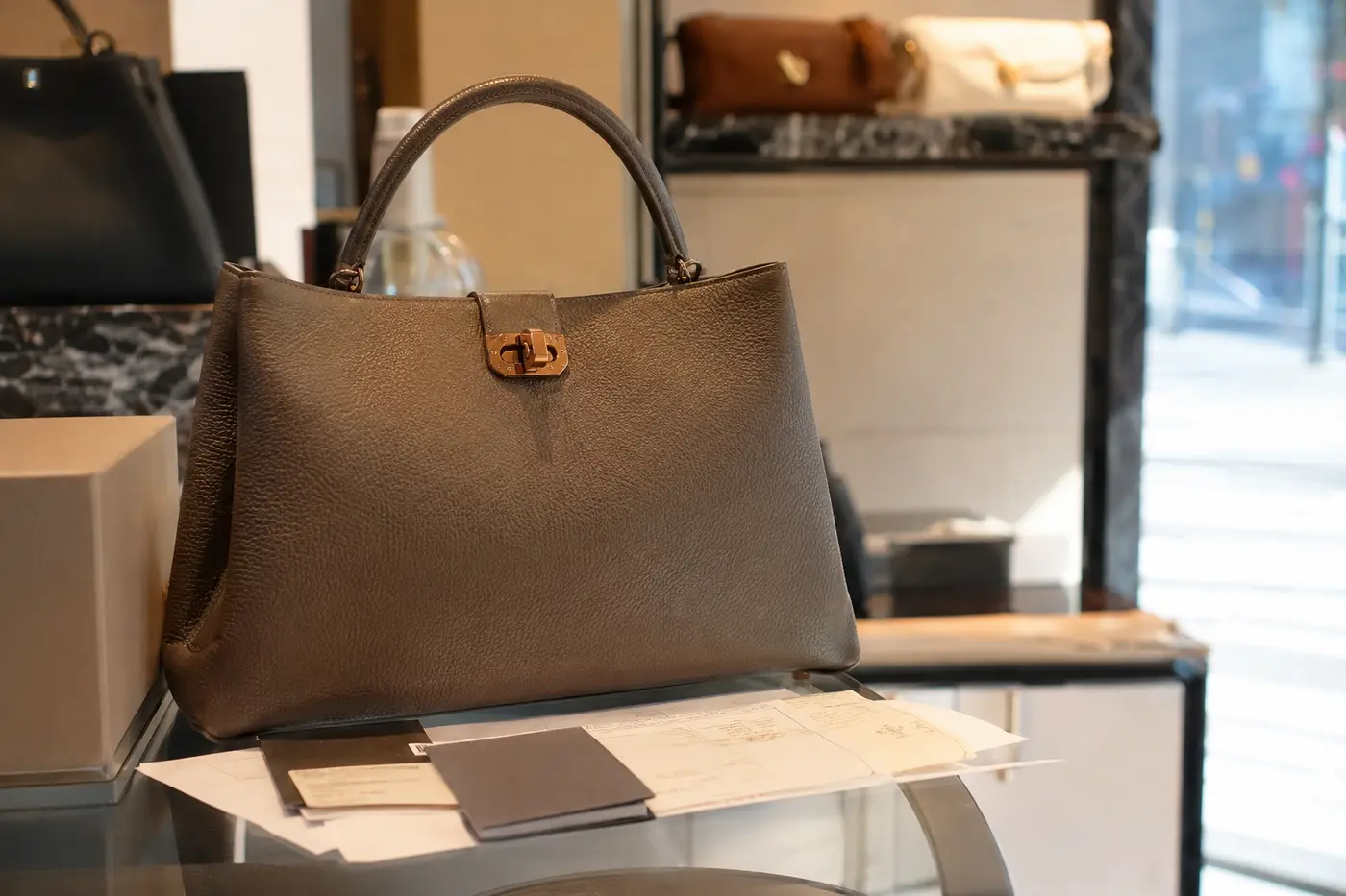 A high-value handbag purchase with invoice, model reference and tax-refund documents