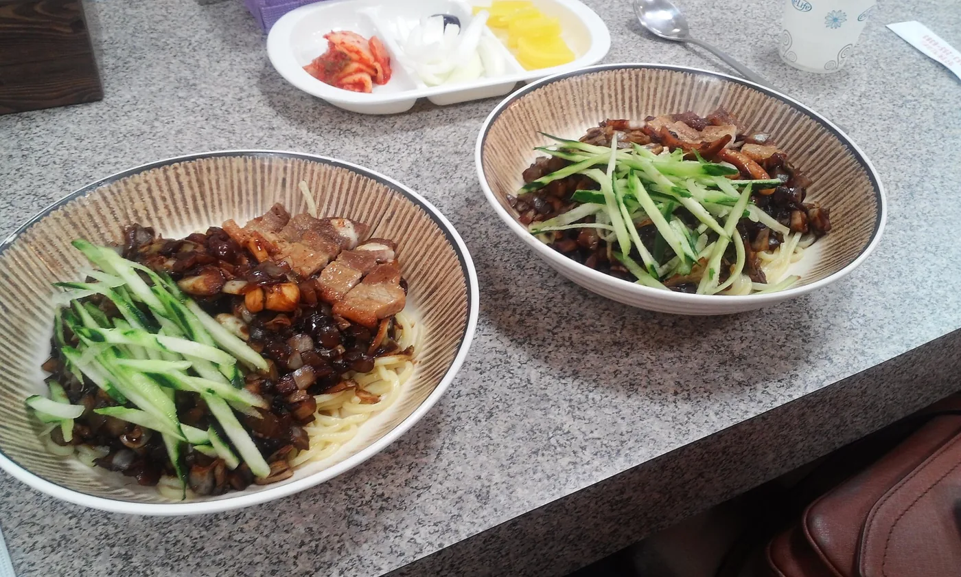 Jajangmyeon noodles covered in a glossy black-bean sauce
