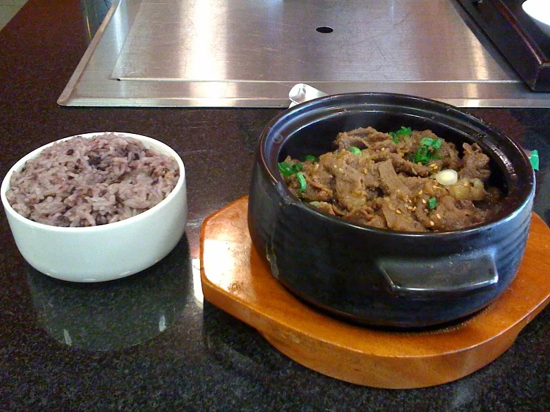 Bulgogi served with rice and Korean side dishes