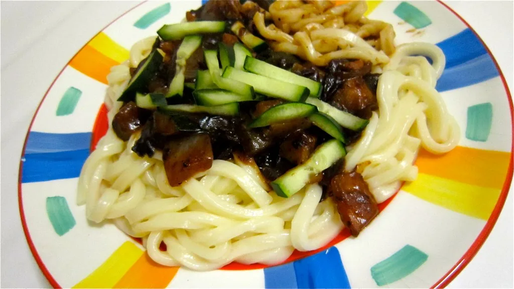 Jajangmyeon noodles covered in a glossy black-bean sauce