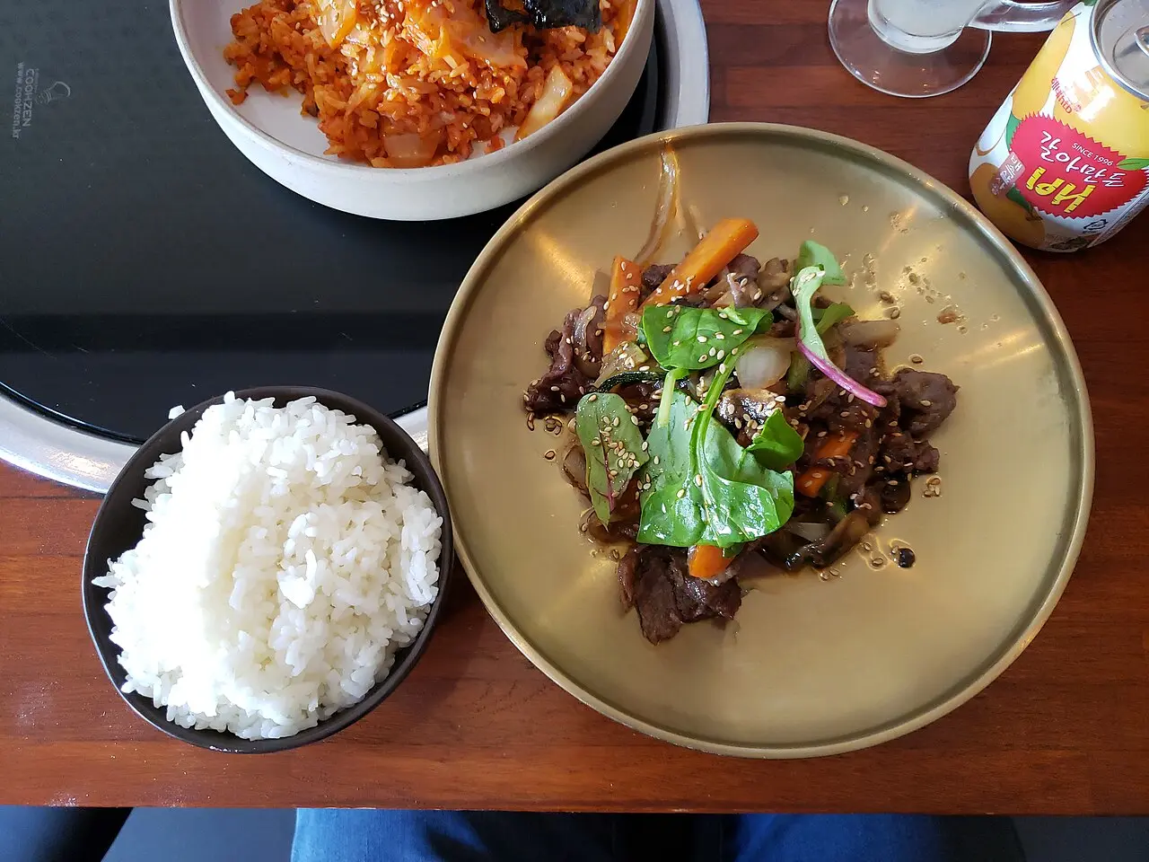 Bulgogi served with rice and Korean side dishes