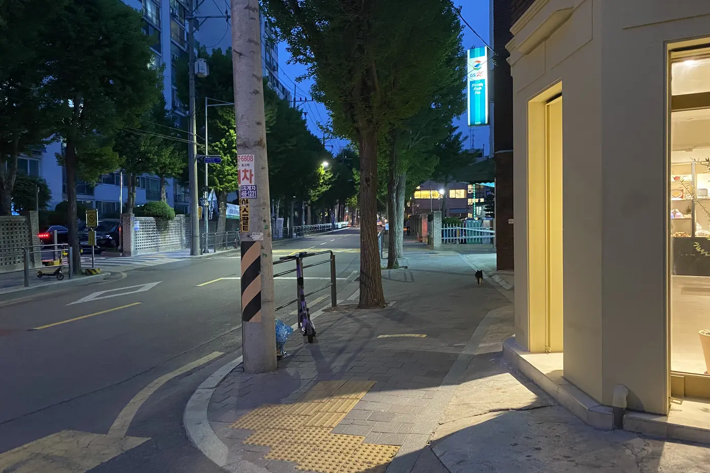 A real evening street scene in Seongsu-dong with low industrial buildings and local storefronts
