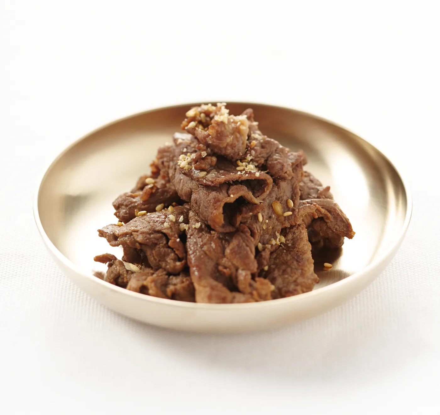 Bulgogi served with rice and Korean side dishes