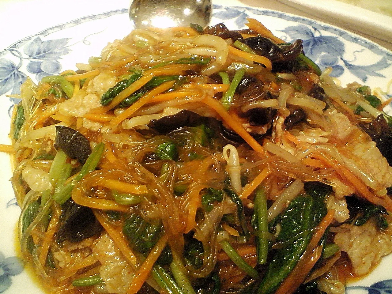 Japchae glass noodles stir-fried with vegetables and mushrooms