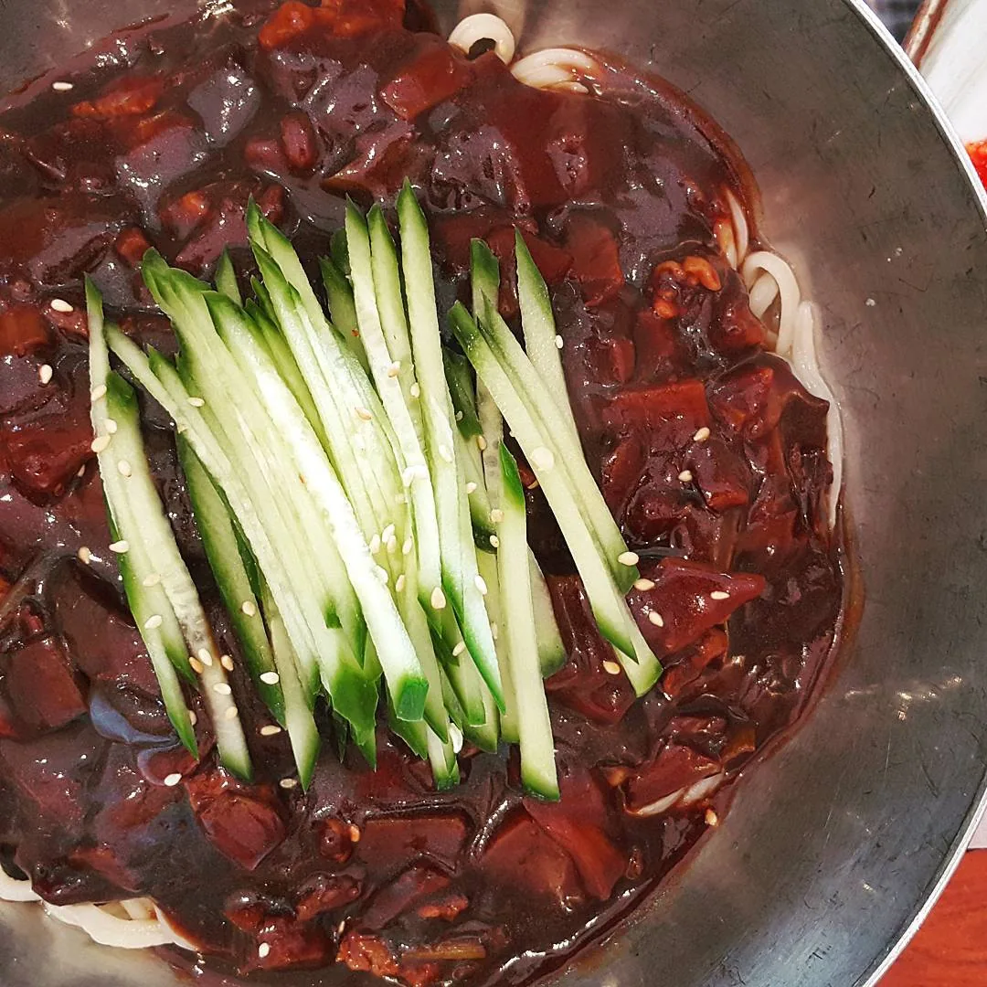 Jajangmyeon noodles covered in a glossy black-bean sauce
