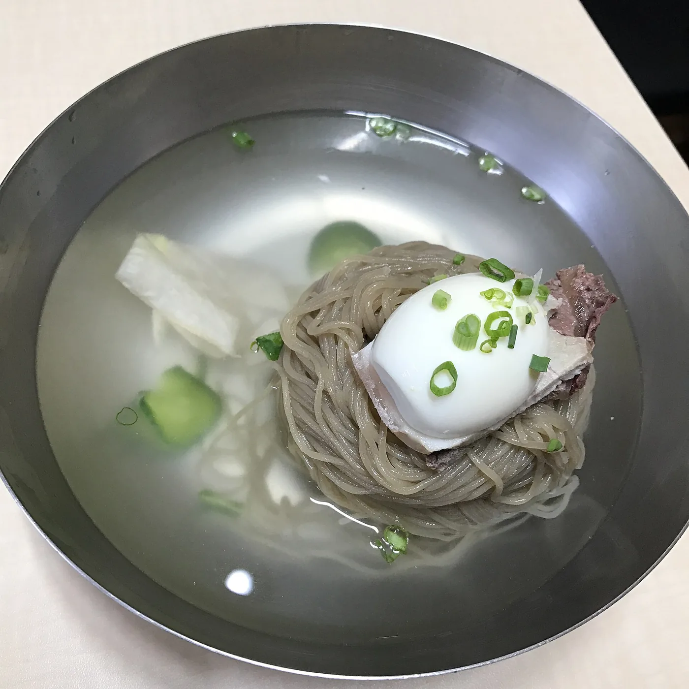 Seoul-style Pyeongyang naengmyeon in clear chilled broth