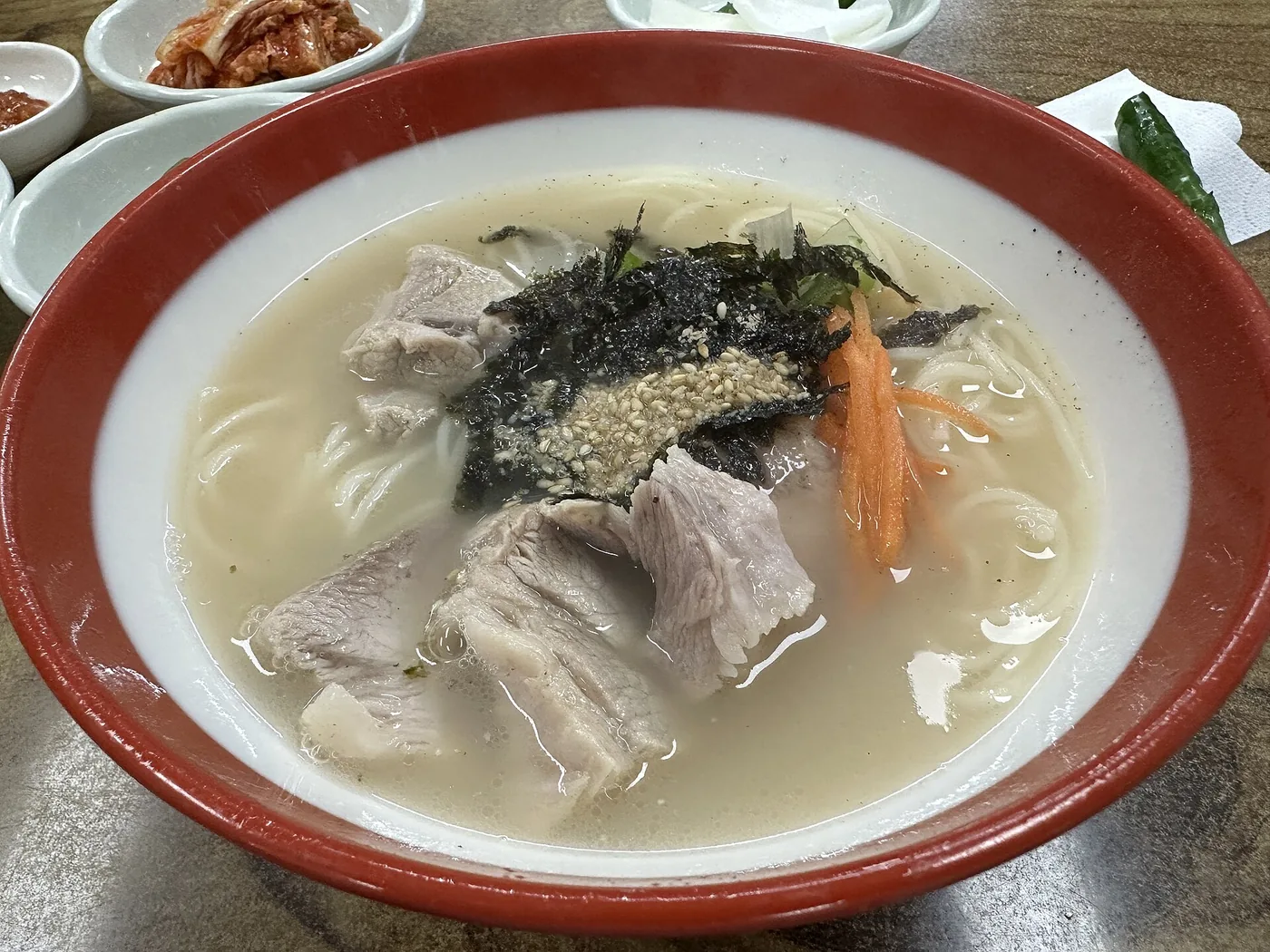 Jeju pork noodles topped with boiled pork slices