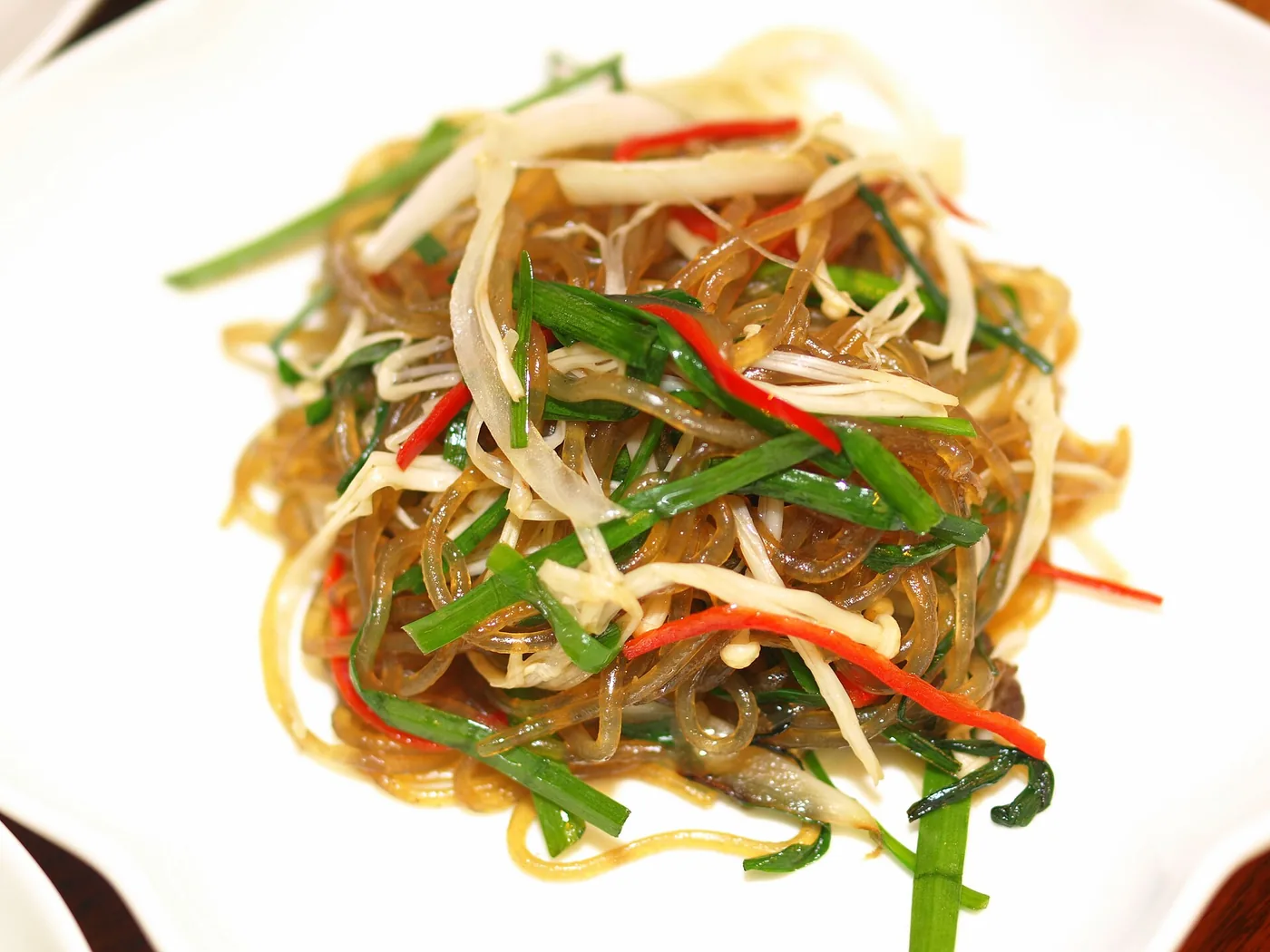 Japchae glass noodles stir-fried with vegetables and mushrooms