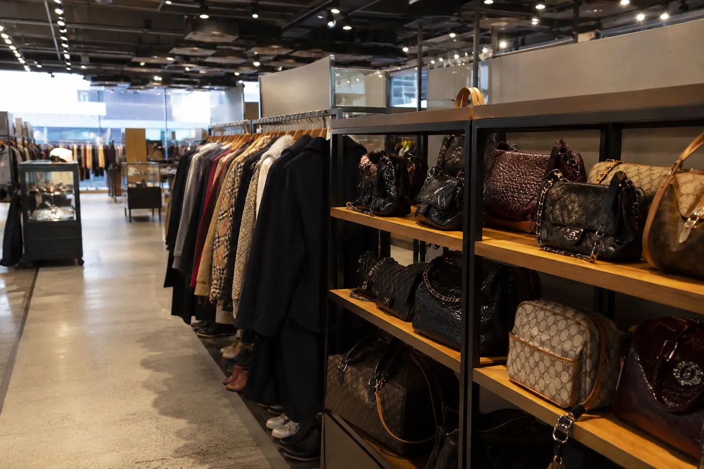 A balanced view of authenticated pre-owned bags and outerwear inside a large Seoul store